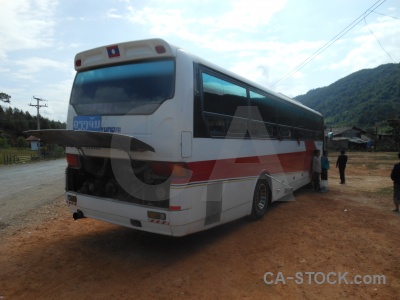 Southeast asia vehicle tree person bus.