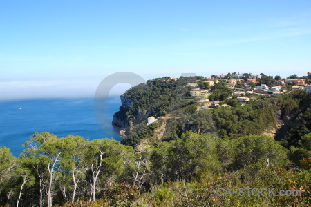 Spain blue sky cliff green.