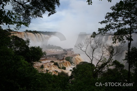 Spray iguazu falls tree iguassu sky.