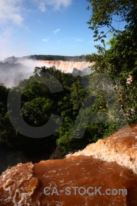 Spray waterfall iguazu river argentina sky.