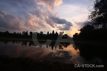 Sunrise sunset silhouette water angkor wat.