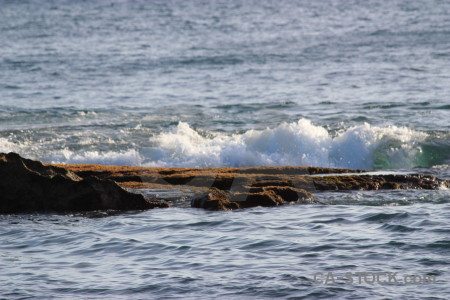 Surface wave sea rock water.