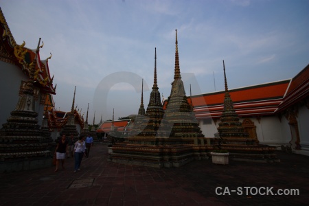 Temple of the reclining buddha person ornate gold bangkok.