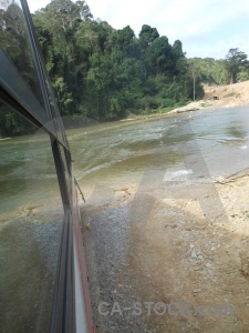 Tree bus river laos vehicle.