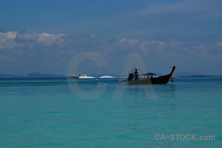 Tropical sky long tail ruea hang yao sea.