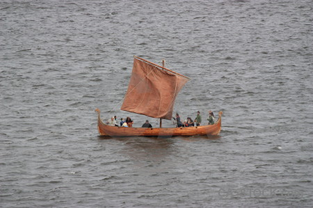 Vehicle gray boat person.