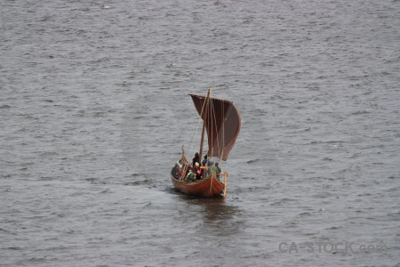 Vehicle gray boat person.