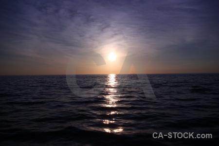 Water cloud sunrise sea reflection.