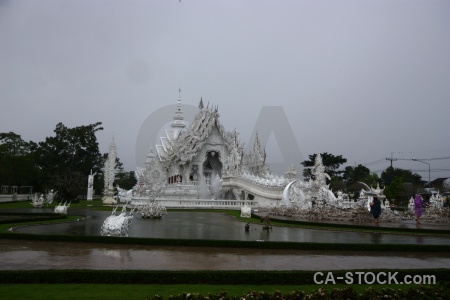 White temple wat rong khun thailand tree pond.