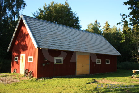 Yellow green building red barn.